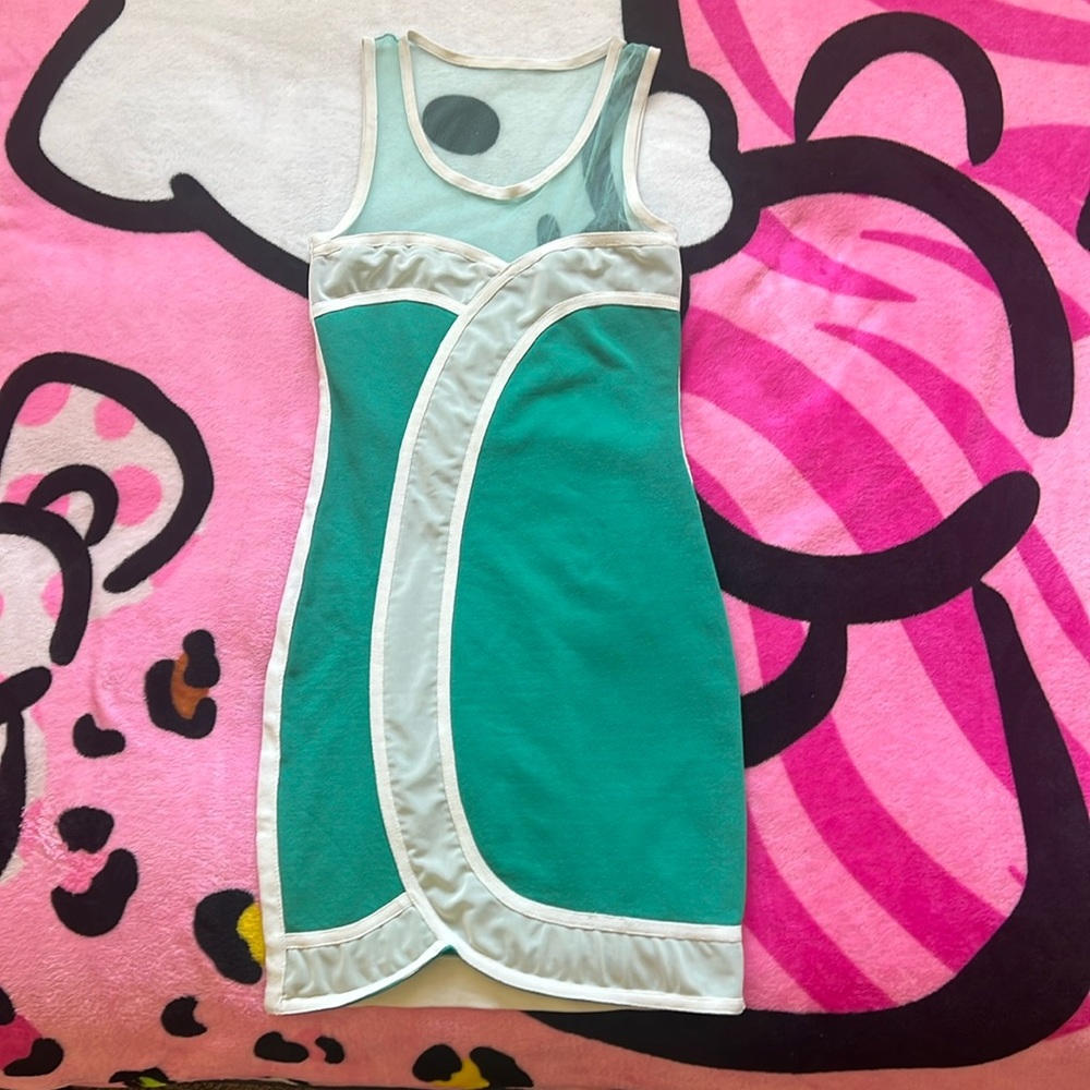 turquoise wow couture dress with mesh neckline